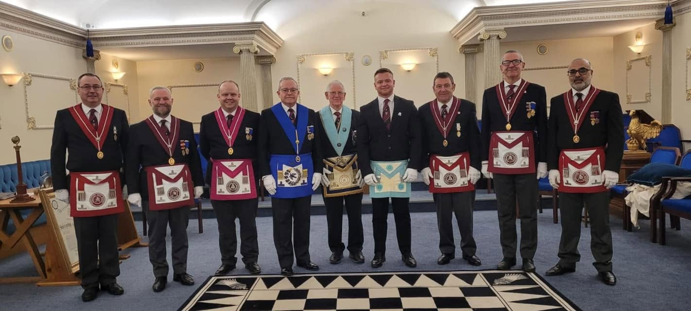 A group of Facula Lodge members in regalia standing together
